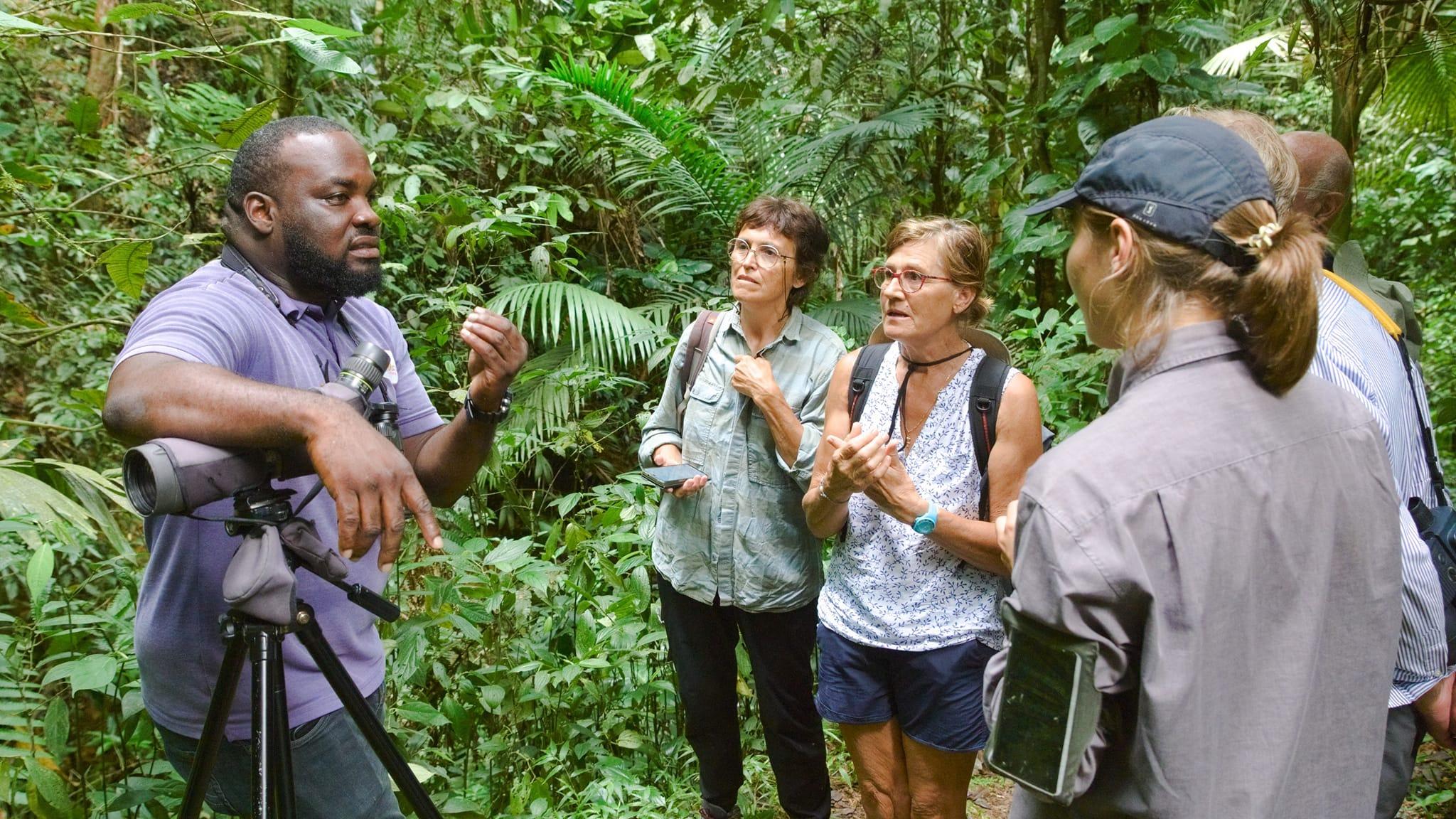 Zolani Frank with tourists in the Tobago Rainforest