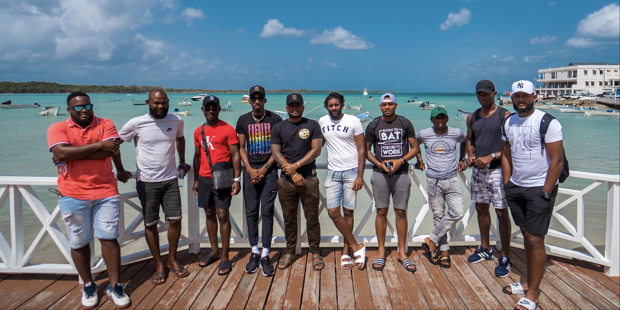 Men gathered on the Buccoo Boardwalk