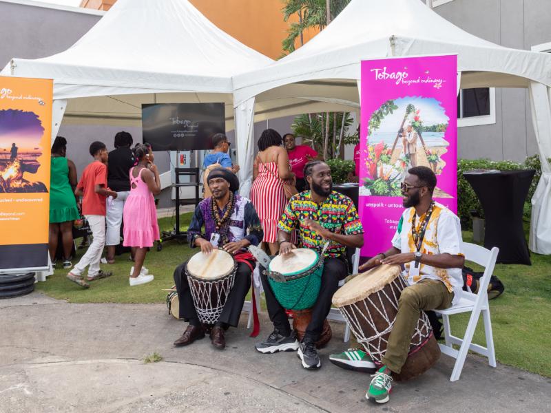 Drummers play alongside the Tobago Beyond team's tents at Sheraton Mall, Barbados